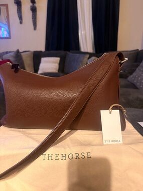 The Horse Lottie in Coffee color. Like new.